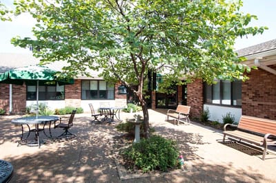 Outdoor courtyard with benches and tables