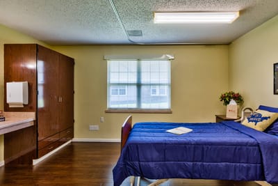 Private resident room with bed and window