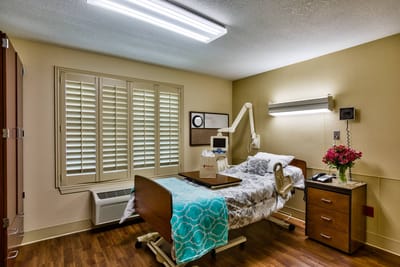 Cozy resident room with a hospital bed and decor