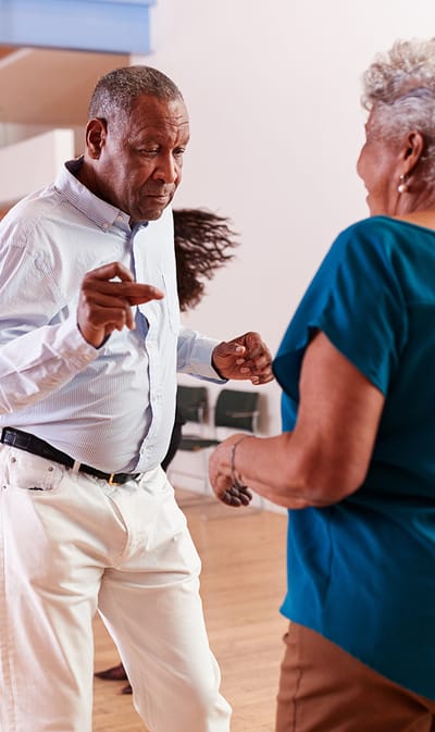St. Andrew’s Apartments at Kirksville, independent living in Kirksville, MO — Seniors dancing joyfully in a community recreation room