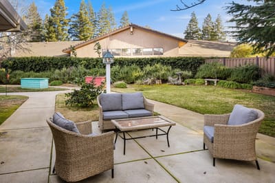 Outdoor seating area with a garden view