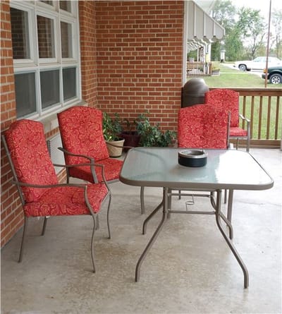 Outdoor seating area with chairs and table