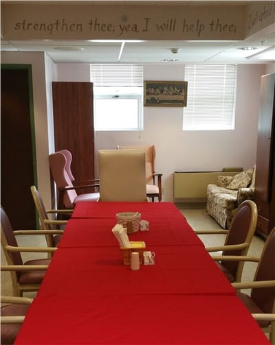 Interior view of a dining area with red tablecloths