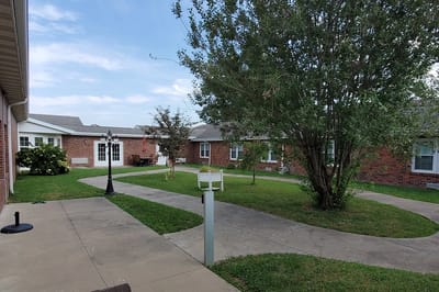 Outdoor pathway and greenery at the facility