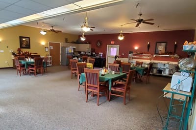 Dining room with tables set for residents