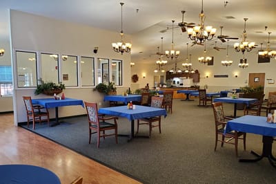 Bright dining room with tables set for meals