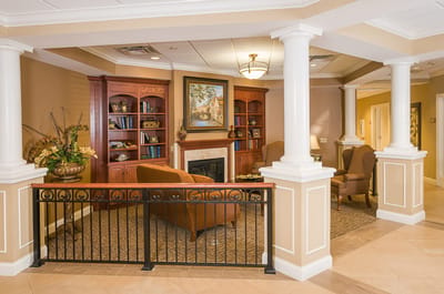Cozy common area with seating and bookshelves
