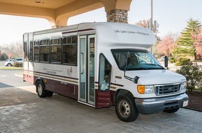 Facility transport van parked at the entrance