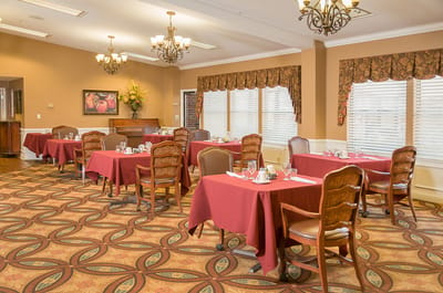 Dining room with tables set for meals