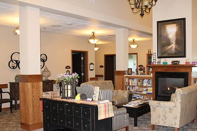 Cozy common area with seating and bookshelves