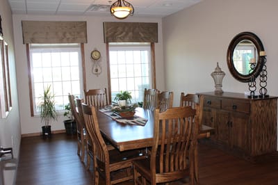 Dining area with wooden furniture and natural light