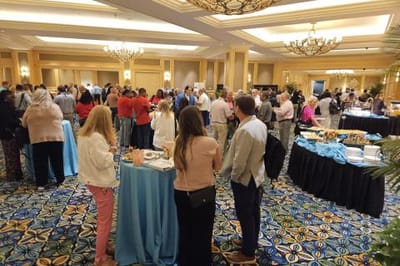 Crowd of people at a social event in a hall