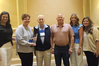 Staff and residents posing for an award photo