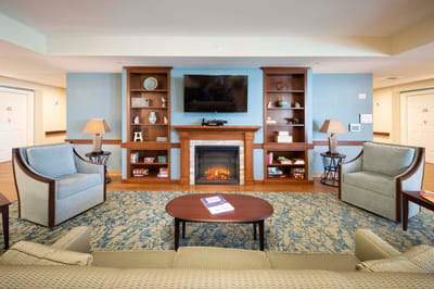 Common area with seating and fireplace