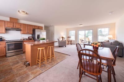 Bright common area with kitchen and dining space