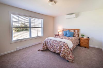 Brightly designed private resident room with a window