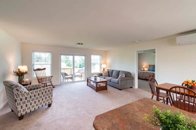Bright living room with seating and dining area