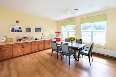 Bright common area with seating and windows