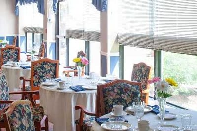 Bright dining area with floral table settings