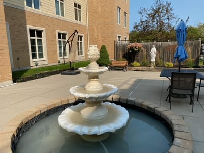 Outdoor space with a fountain and seating area
