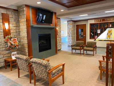 Cozy lobby area featuring comfortable seating and a fireplace