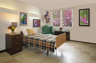 Cozy resident room with bed and window view