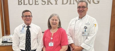 Staff members posing in the dining area