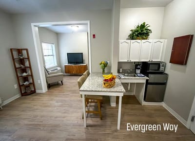 A cozy resident living space with a kitchen area