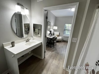 A beautifully arranged resident room with bathroom