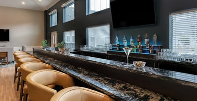 Interior view of a stylish bar area with a long countertop