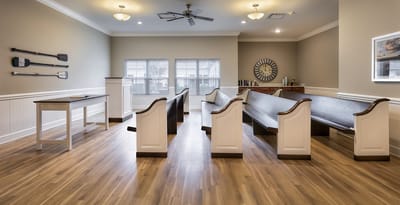 Interior view of a common area with wooden benches