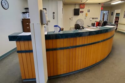 Reception area with wooden front desk