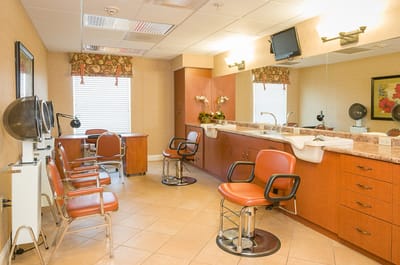 Hair salon interior with styling chairs and mirrors
