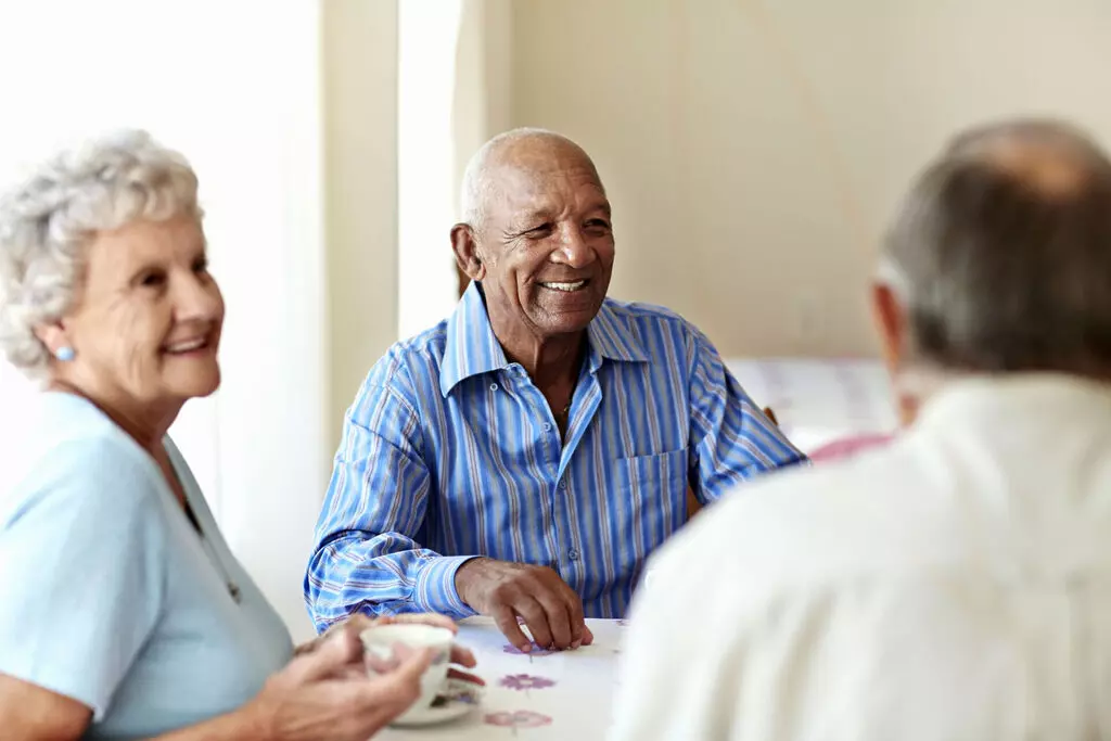 Residents engaged in conversation during a social gathering