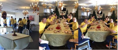 Residents and staff enjoying a meal together in a common area
