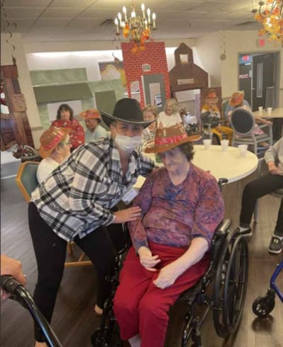 Staff member helping a resident during an activity