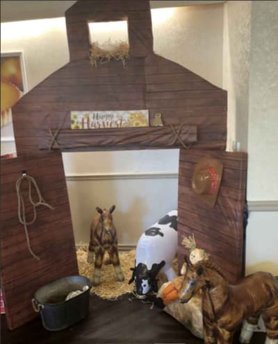 Decorative barn setup for a harvest-themed event