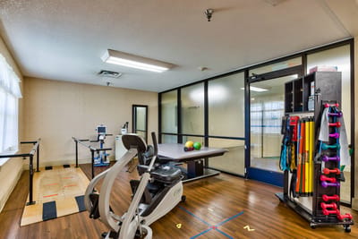 Rehabilitation area with exercise equipment and therapy space