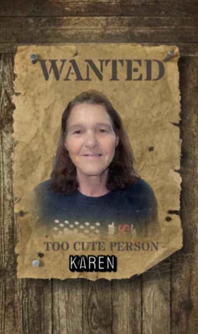 A humorous 'wanted' poster featuring a smiling woman