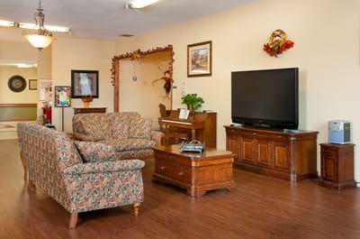 Common area with seating and entertainment unit
