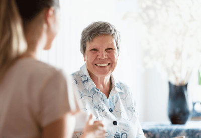 Resident enjoying a conversation with staff.