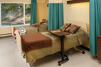 Resident room with two adjustable beds and decorations
