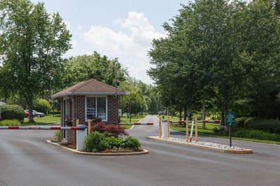 Entrance gate to Oakbridge Terrace with landscaped surroundings