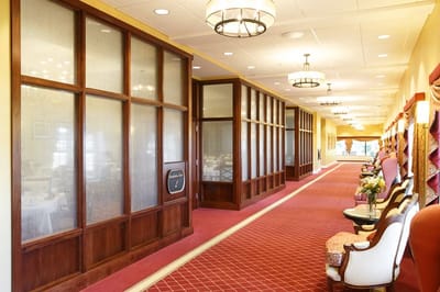 Interior hallway of a senior living facility with seating area