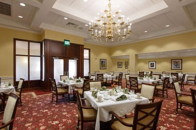 Dining room with elegant tables and chandelier