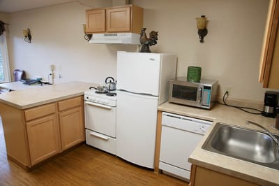 Clean kitchen area with appliances and counter space
