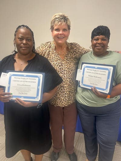Staff members receiving certificates of recognition