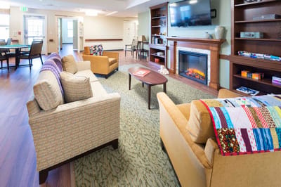 Cozy common area with seating, fireplace, and decor