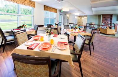 Dining area with tables set for a meal