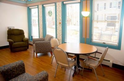 Bright common area with seating and natural light